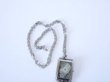 French Vintage Necklace watchcase with key and eiffel tower and number 28 tag wristwatch bezel assemblage